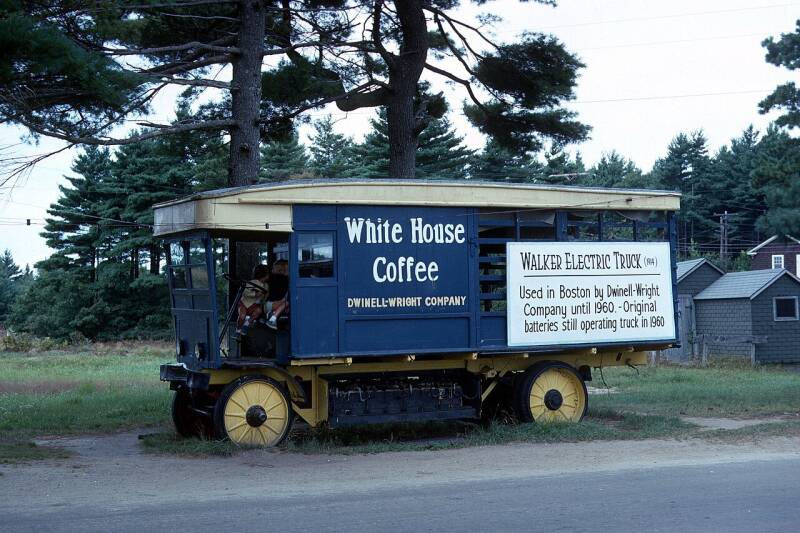 a blue antique truck with White House Coffee markings