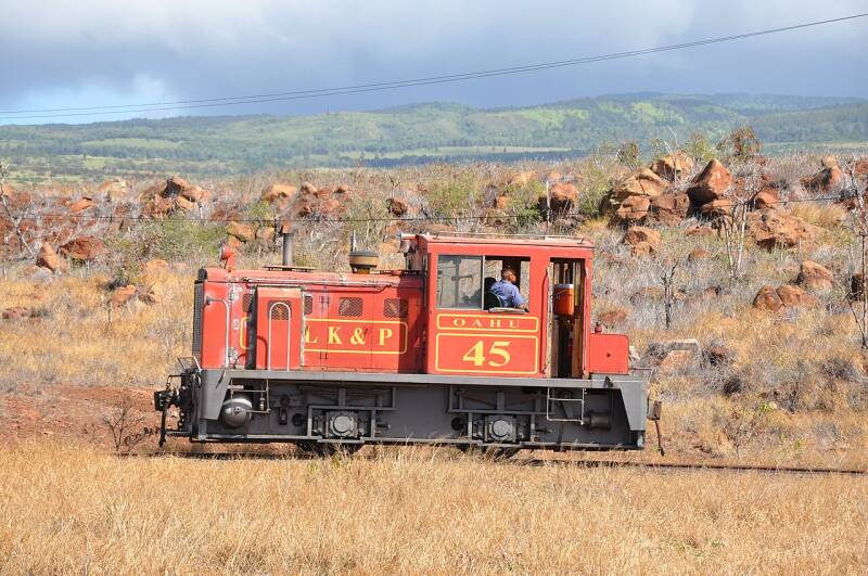 a small orange Plymouth diesel locomotive