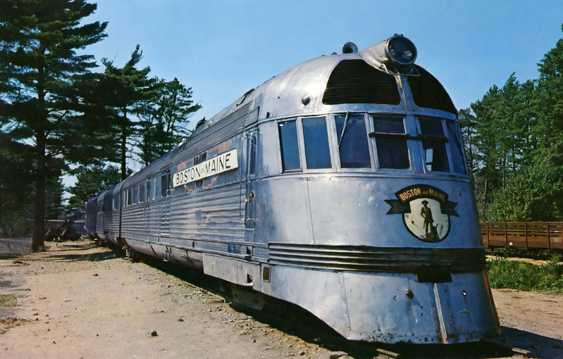 a 30's era shovel-nose streamlined stainless steel locomotive and  train