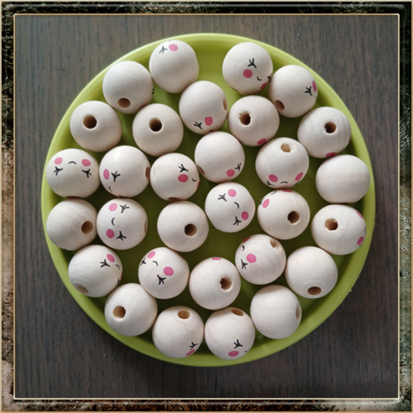 30 Houten kralen met dichte ogen gezichtje 20mm