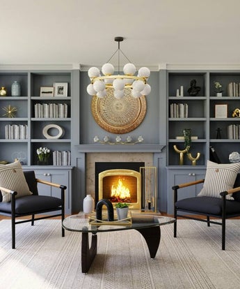 Beauiful cabinetry painted by JSP Painting in Lebanon, MO with soft grey tones in a statley room with warm fireplace and contemporary light fixture.