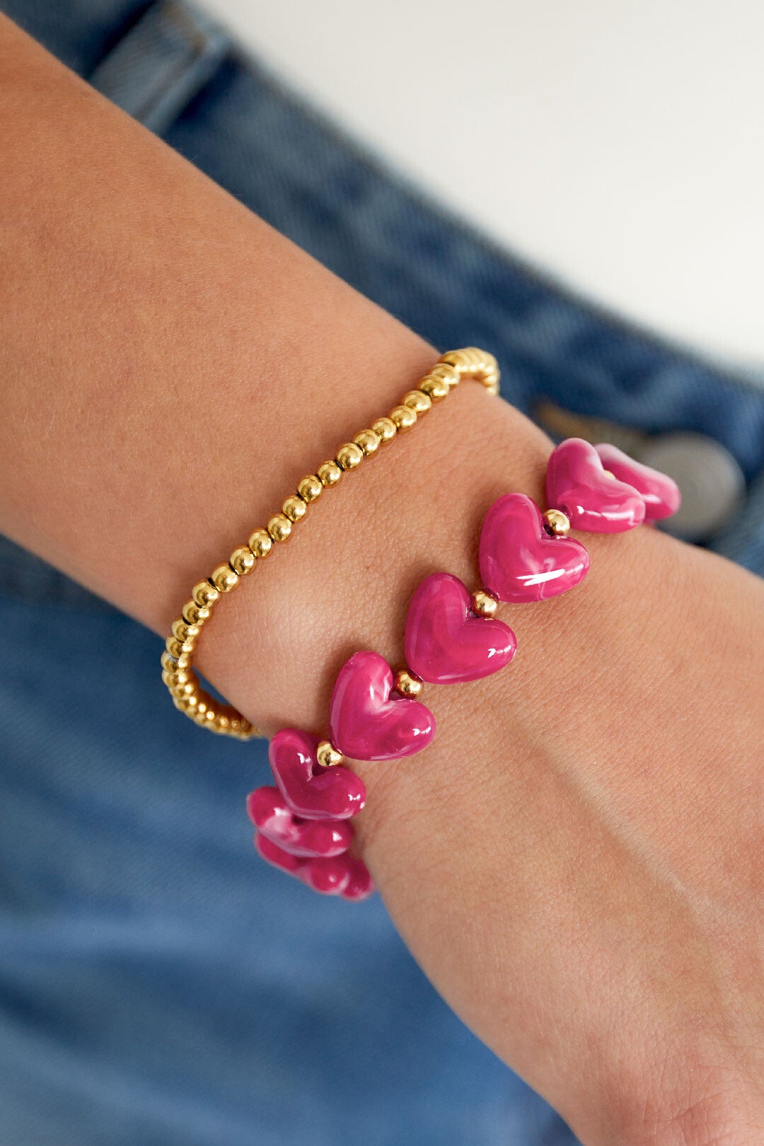 Hartjes kralenarmband fuchsia