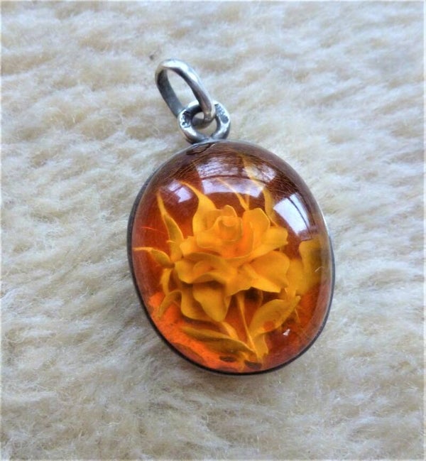 Schitterende Barnsteenhanger met zilver