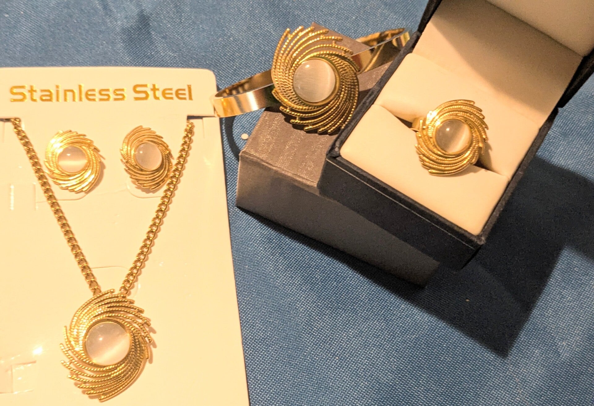 Woman Stainless Steel Gold Tone Set, Necklace, Earrings, Ring and Bracelet with Pearl Like Stone Beautiful Design