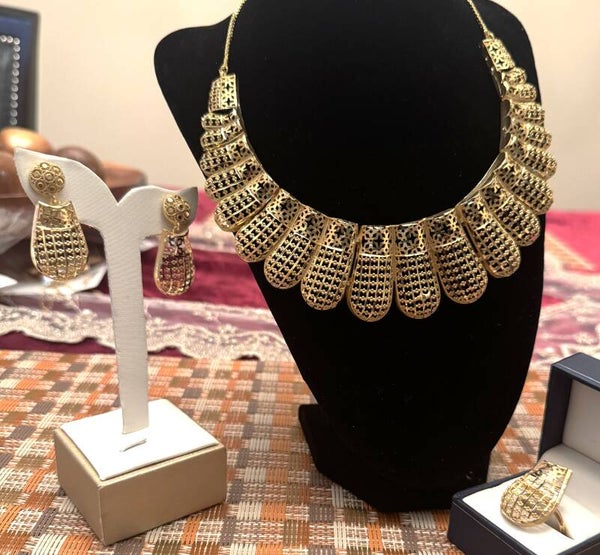 Beautiful Gold Tone Large Necklace, Ring, and Earrings with Elegant Tribal like Design