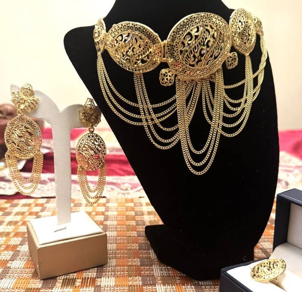 Beautiful Gold Tone Large Necklace, Ring, and Earrings with Elegant Designs and Chains that Dangle