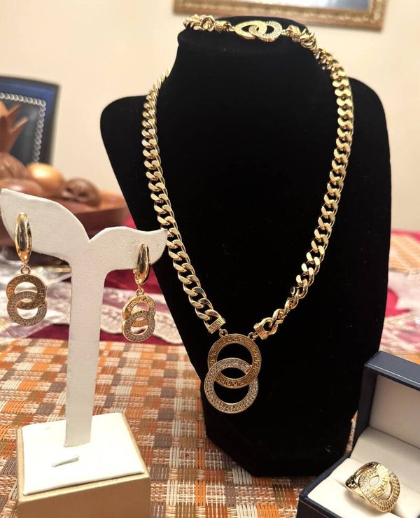 Beautiful Gold Tone Cuben Link Necklace, Bracelet, Ring and Earrings with Entwined Circles One with CZ Design