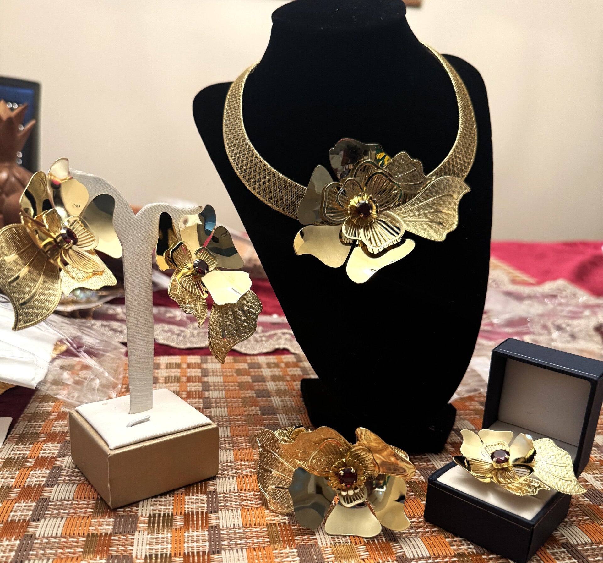 Beautiful Gold Choker Necklace, Bracelet, Ring and Earrings with Layered Flower Design and Red Stone