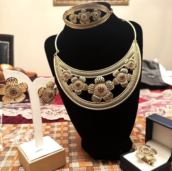 Beautiful Women Gold Tone Necklace, Bracelet, Ring and Earrings with Flower Design.  Brown and White CZ Stones in Center