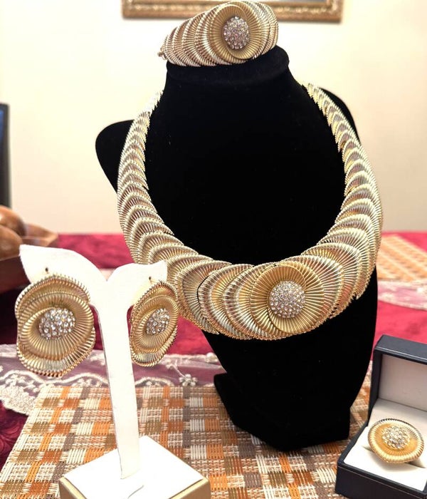 Beautiful Gold Tone Necklace, Ring, Bracalete and Earrings With Beautiful Over Lapping Design With White Stones