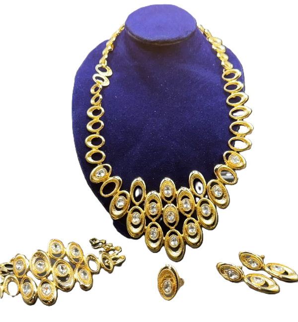Beautiful Womens Gold Tone Necklace, Bracelet, Ring and Earrings with Oval Layers Design with CZ Stones in the Center