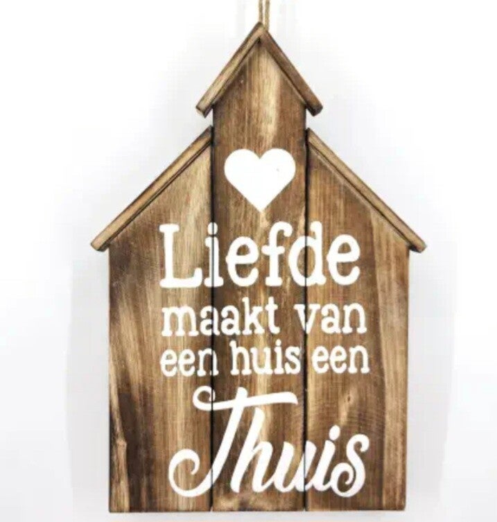 Tekstbord Liefde maakt van een huis