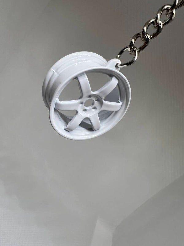 Baby bola white rim key ring