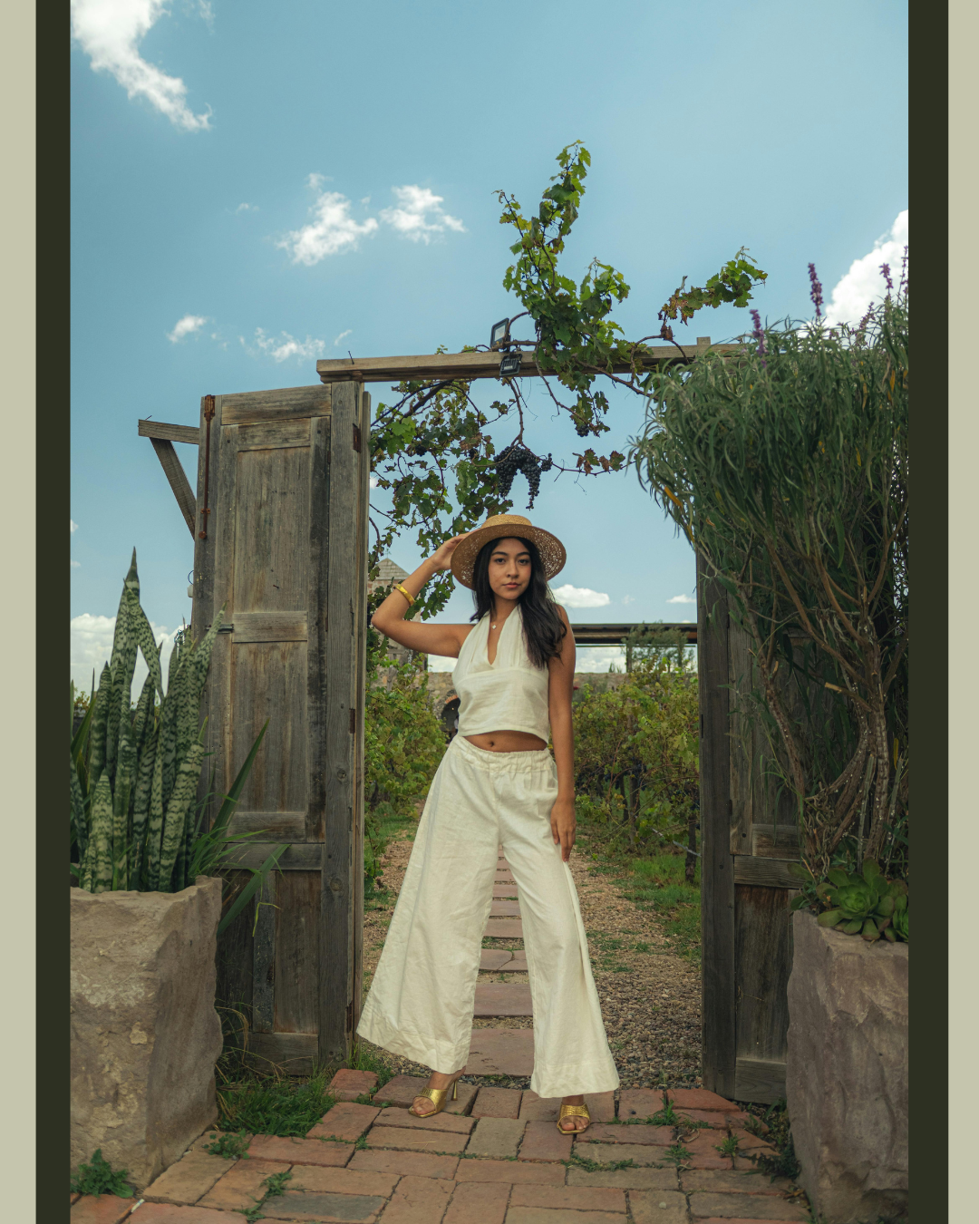 A woman standing in front of a doorway on a path symbolizing a woman standing confidently within her personal boundaries