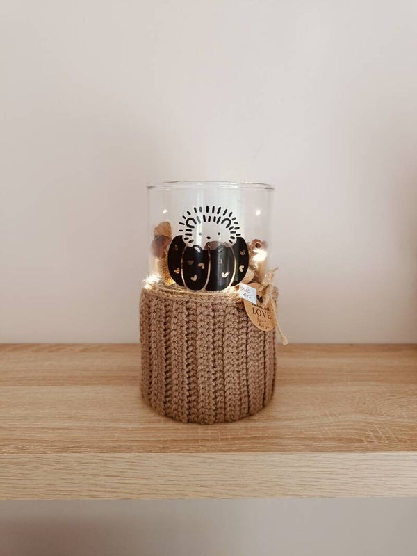 Glazen vaas met kaars