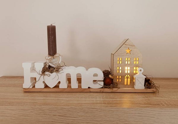 Wordpop 'Home' met verlicht huisje.