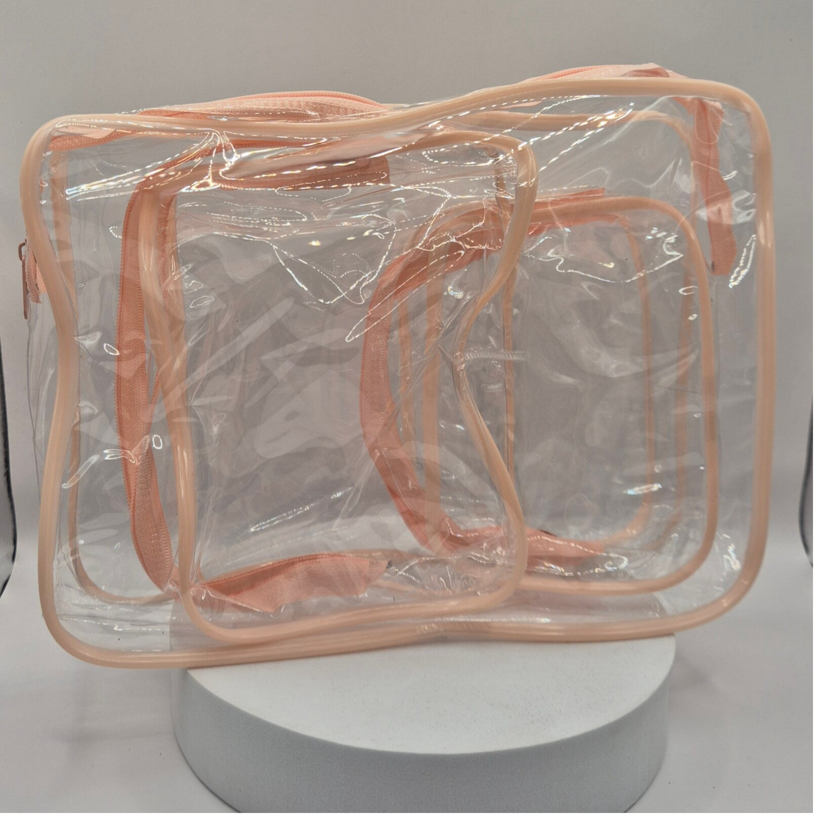 3 trousses de toilette transparentes