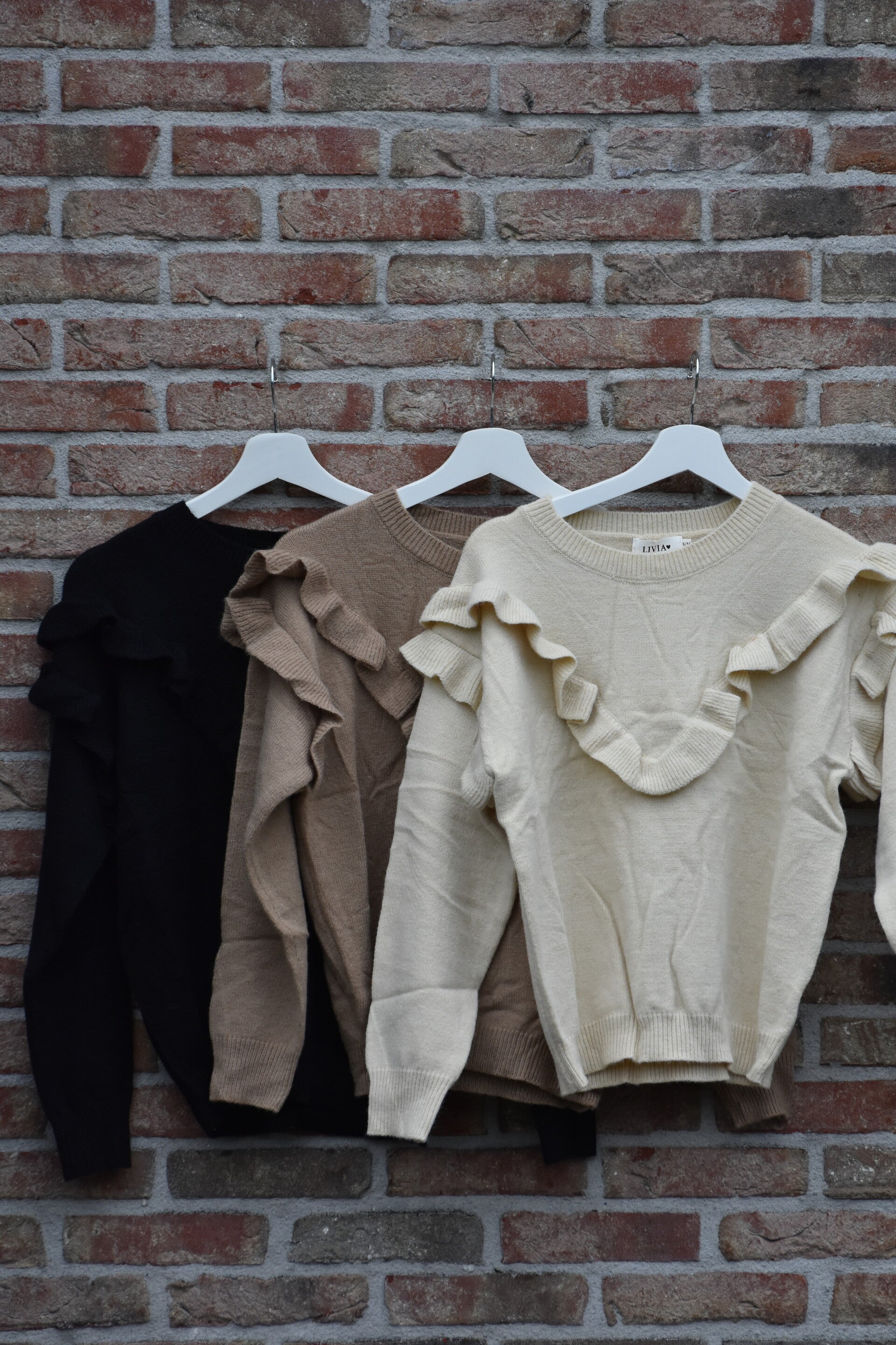 Gebreide top met roezels