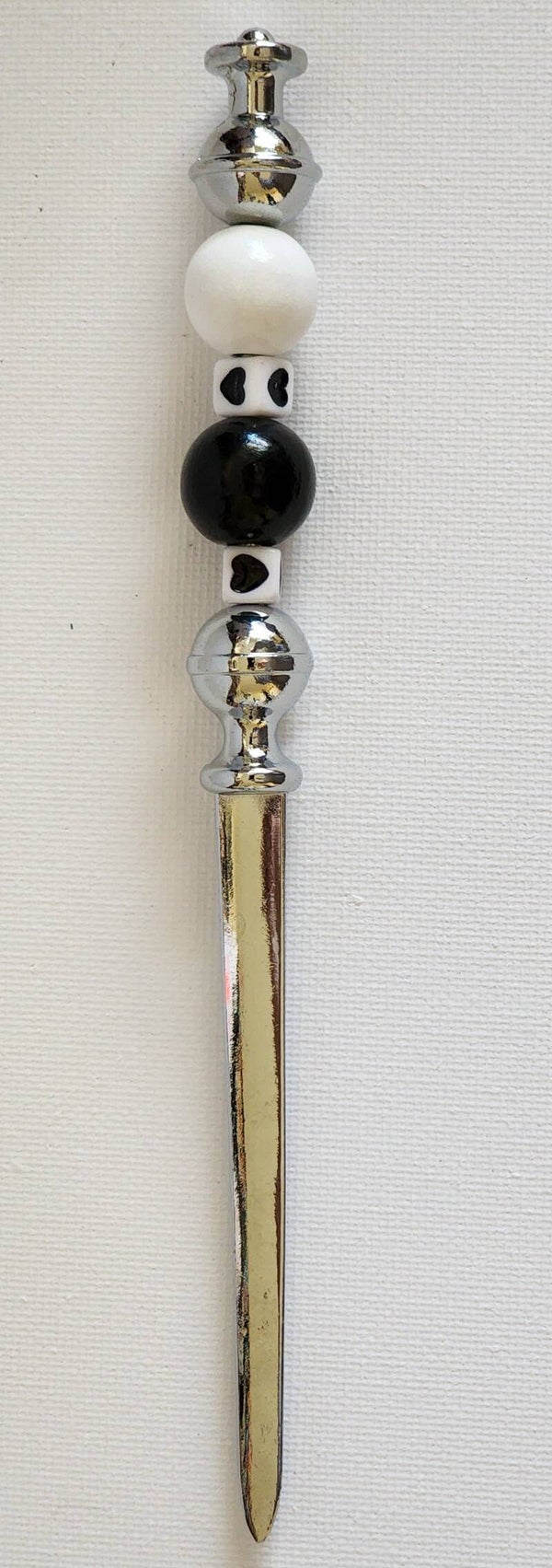 Silver letter opener with black and white heart beads