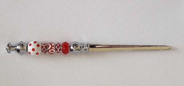 Silver letter opener with red and white beads