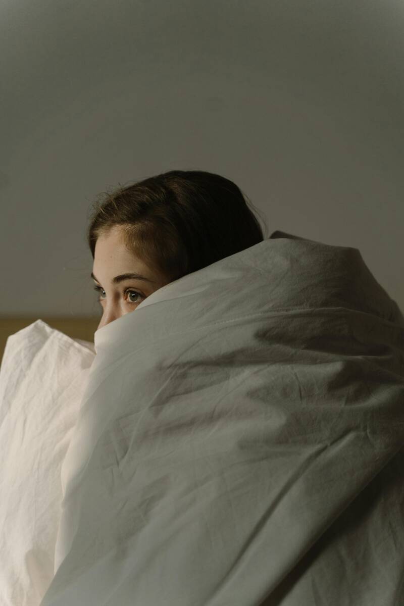 woman wrapped in a duvet