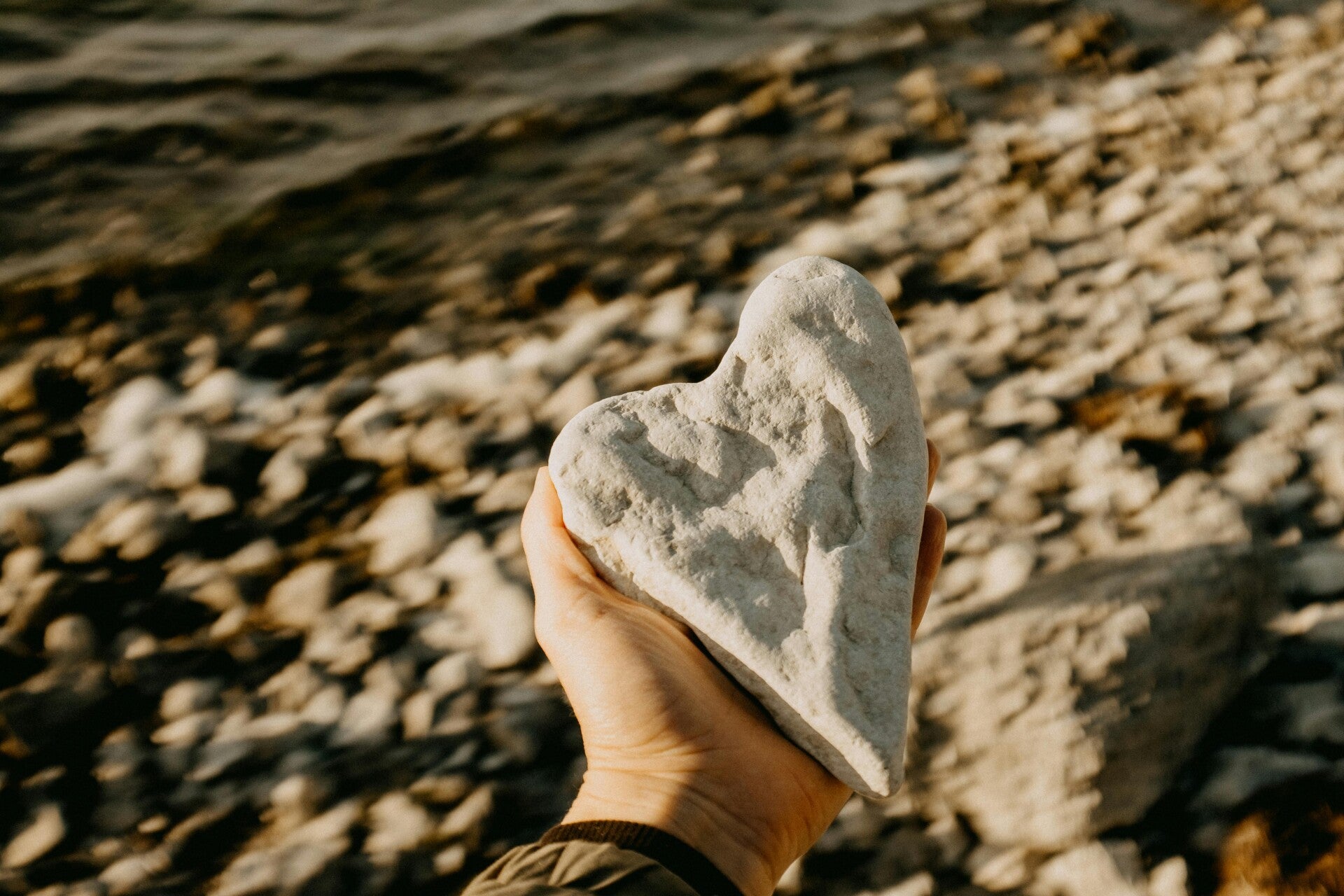 Heart shapped rock on beach