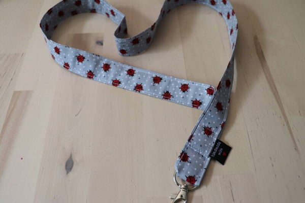 Tour de cou  "Coccinelle" gris