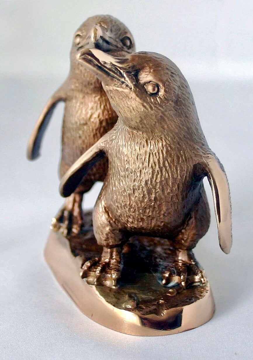 TWO PENGUINS ON A BASE