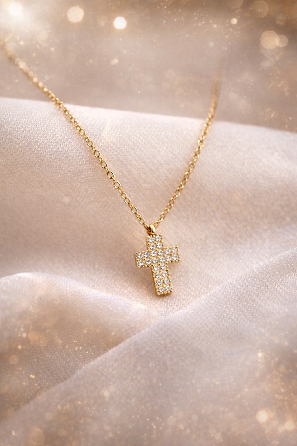 Collier acier doré et croix strass