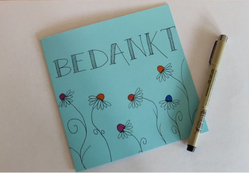 blauwe kaart met Bedankt erop