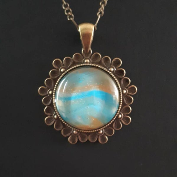 Unique ocean-colored stone in round Tibetan-style necklace hanger (with FREE chain) Product # BCMBTcab2