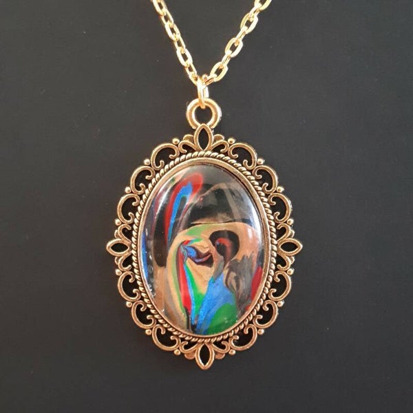 Unique Multi-colored stone in intricate amulet-style oval necklace hanger (with FREE chain) Product # BOMMTcab1