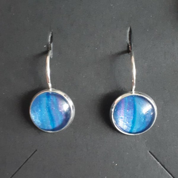 Silver-coloured earrings with unique pink/purple accented stones Product # EarlSCSPcab1