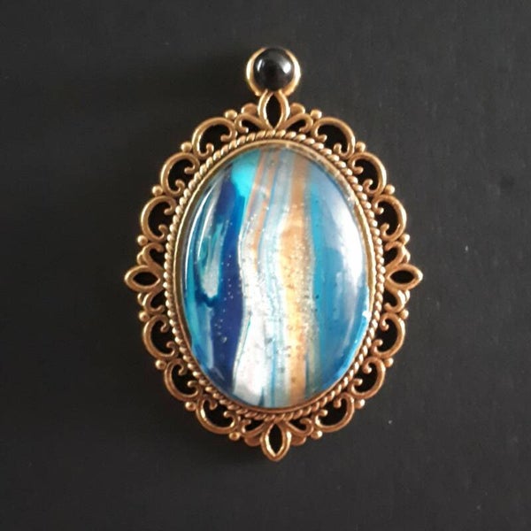 Unique ocean-colored stone in intricate amulet-style oval necklace hanger (with FREE chain) Product # GOMBTcab2