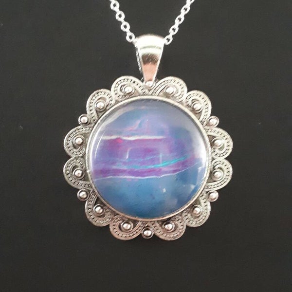 Unique pink/purple accented stone in round Tibetan-style necklace hanger (with FREE chain) Product # SCMBTcab3