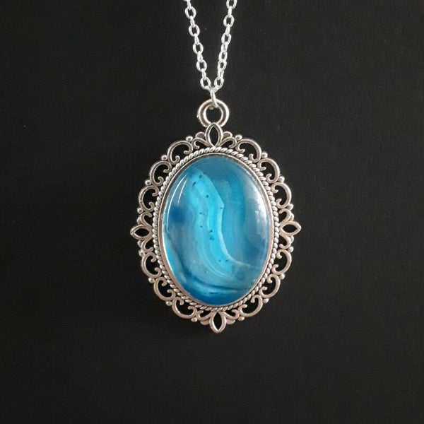 Unique ocean-colored stone in intricate amulet-style oval necklace hanger (with FREE chain) Product # SOMBTcab1