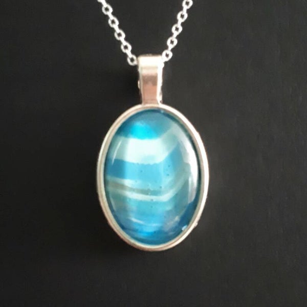 Unique ocean-colored stone in simple oval necklace hanger (with FREE chain) Product # SOMBcab1