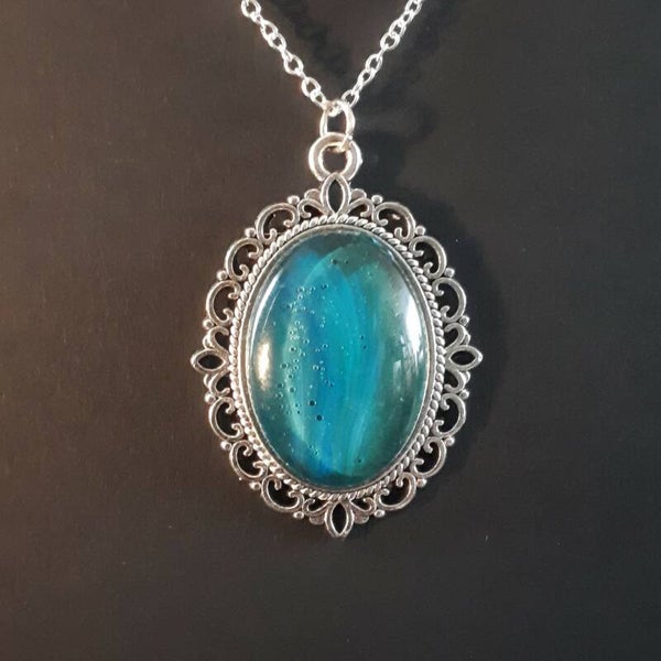 Unique Deep Sea-colored stone in intricate amulet-style oval necklace hanger (with FREE chain) Product # SOMDSTcab2