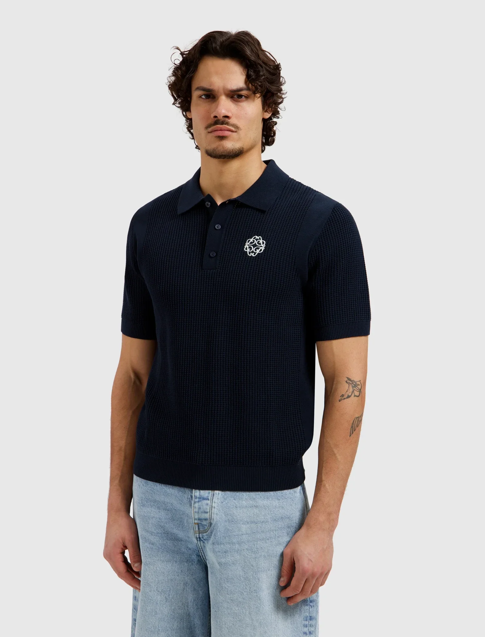 Pure Path Emblem Heren Knit Polo | Navy