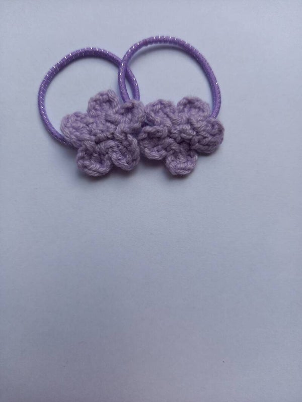 Lila kleur stiekje met een lila kleur bloemetje