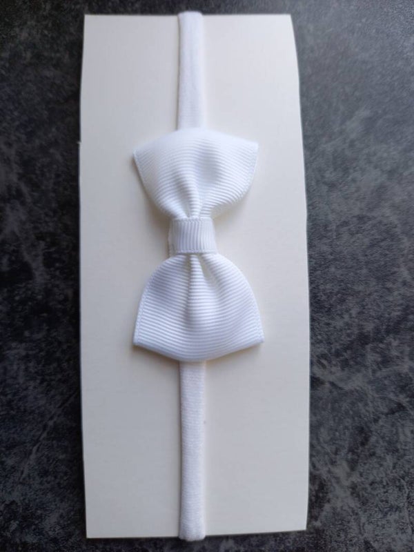 Wit nylon haarbandje met strik