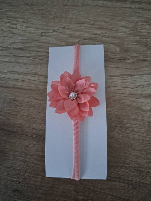 Oud roze nylon haarbandje