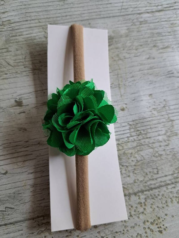 Nylon haarbandje met een groen bloemetje