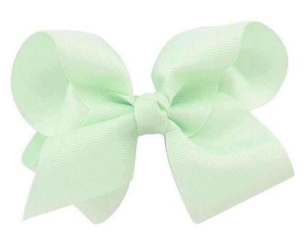 Een haarschuifje met grote mint groene strik