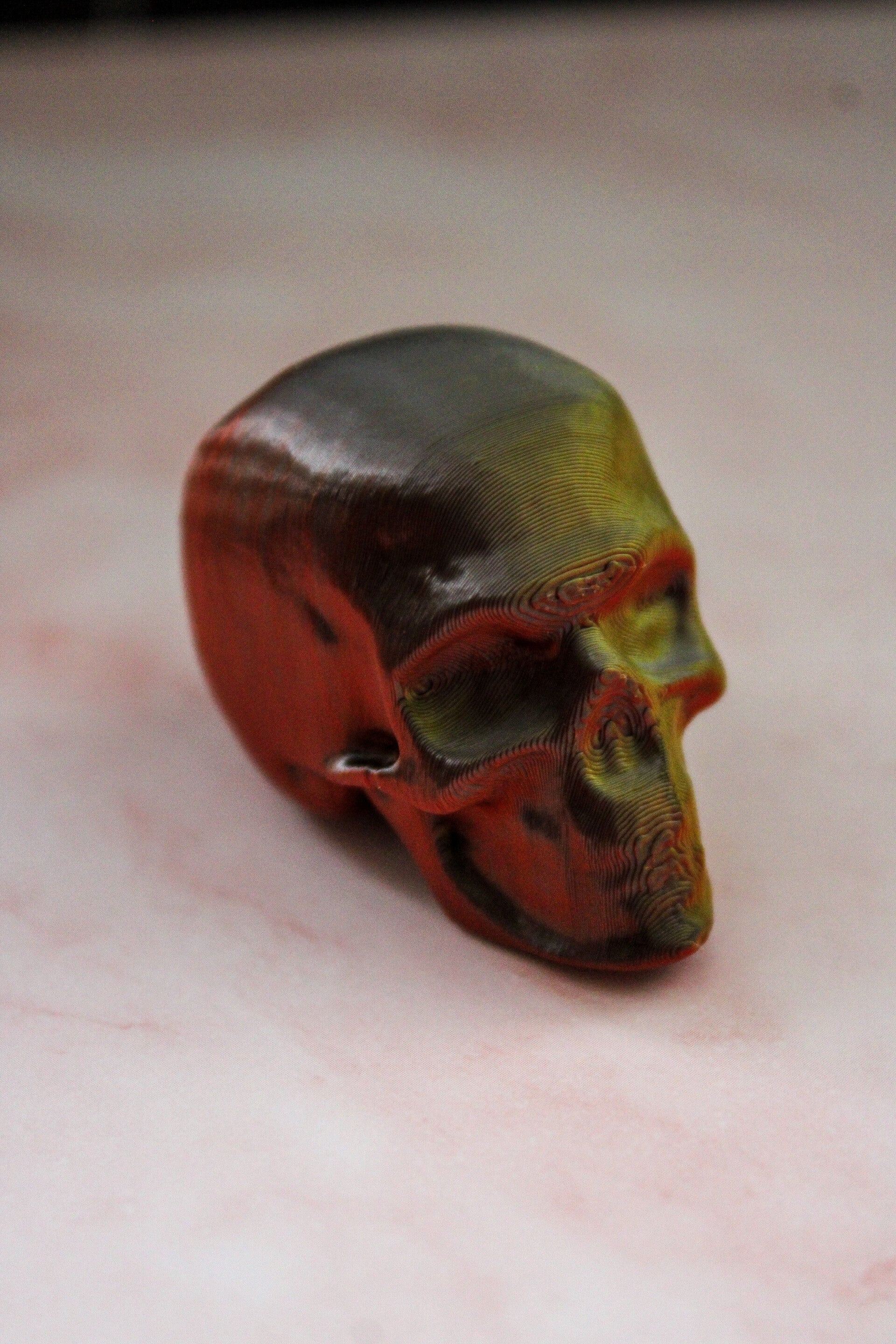 Schedel sleutelhanger brons/rood