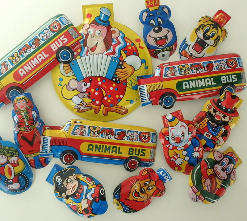 vintage Japanese tin clickers, noisemakers, crickets, buses, lion, tiger, clown, cowgirl