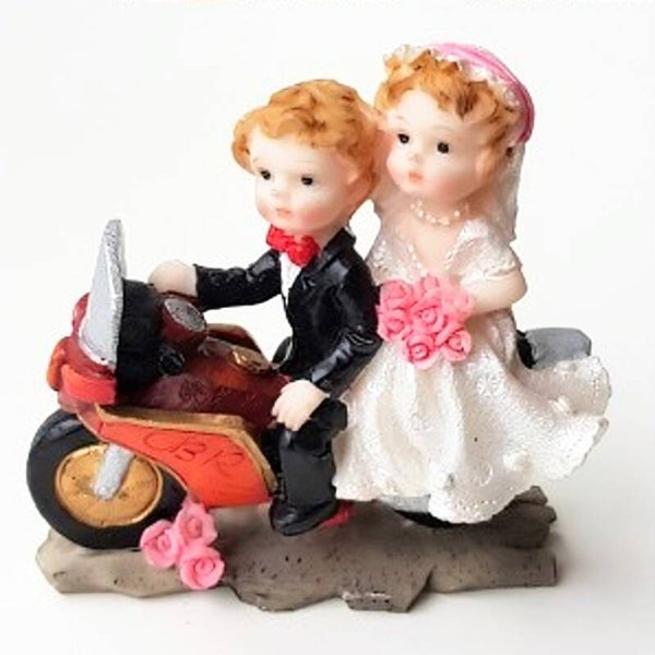 Bruidspaar op rode motor