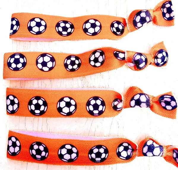 Armband/haarelastiek Voetbal oranje