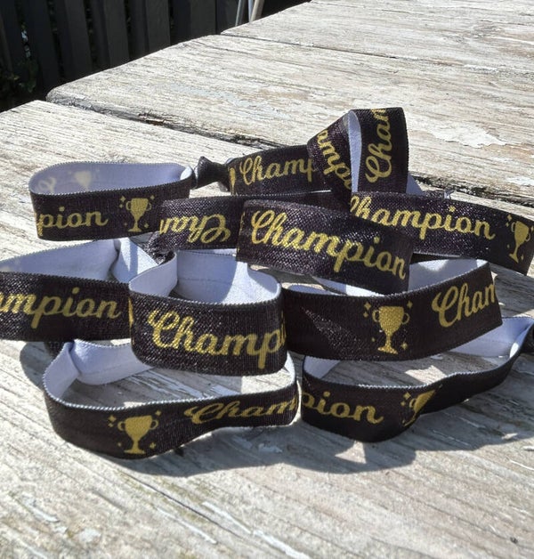 Elastische armband/haarelastiek Champion zwart met goud