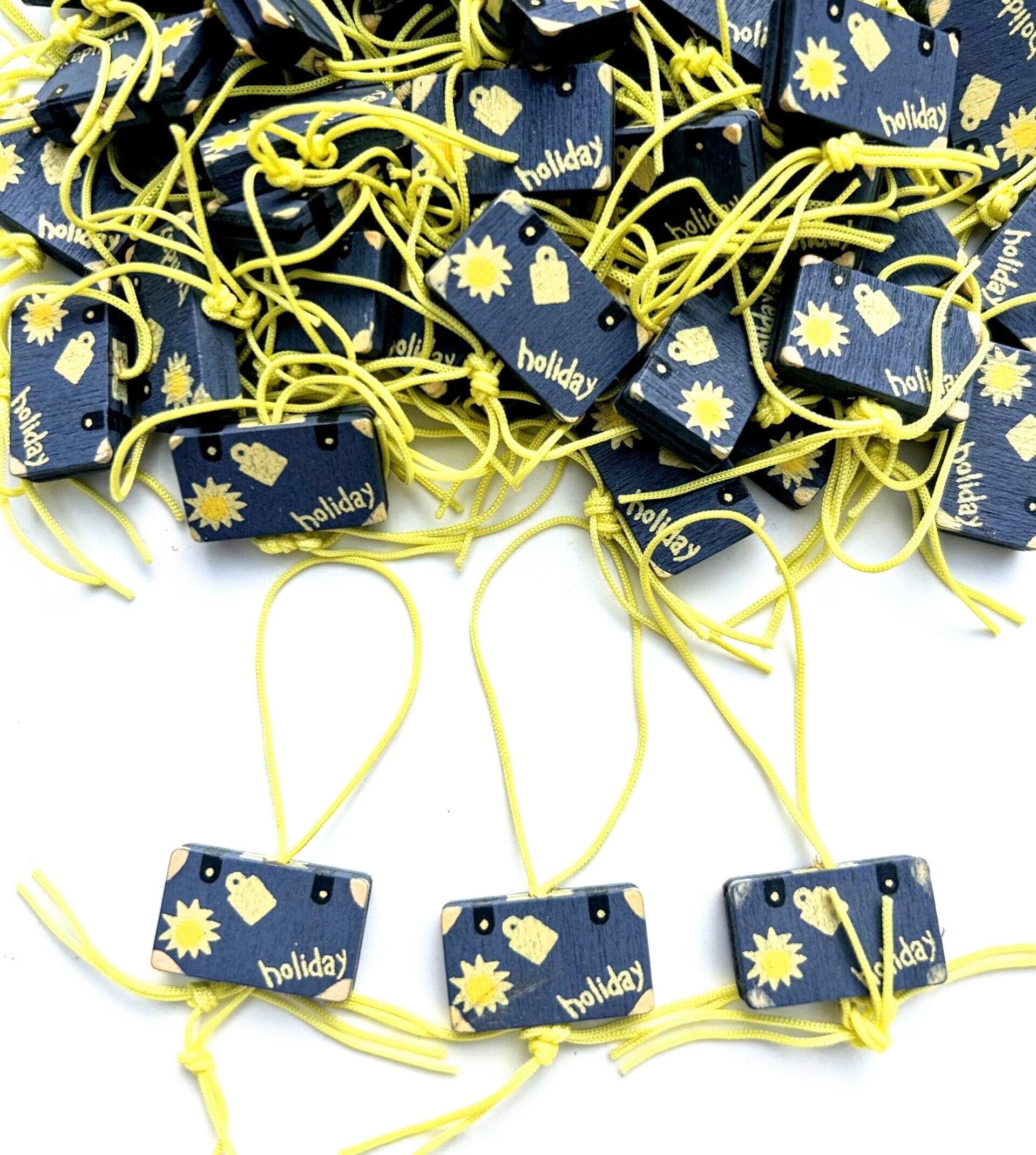 Gelukspoppetje in de vorm van een koffer